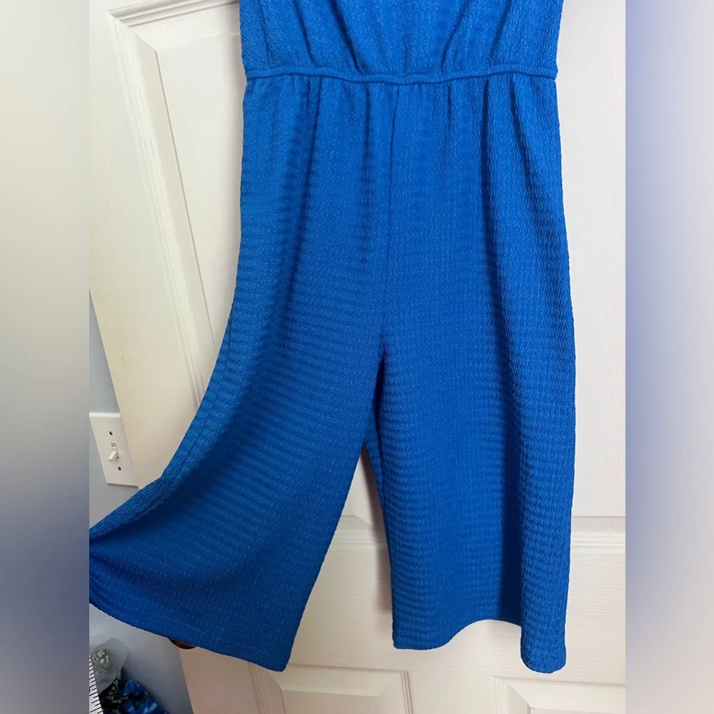 Primark royal blue textured jumpsuit with round neck and flutter sleeves